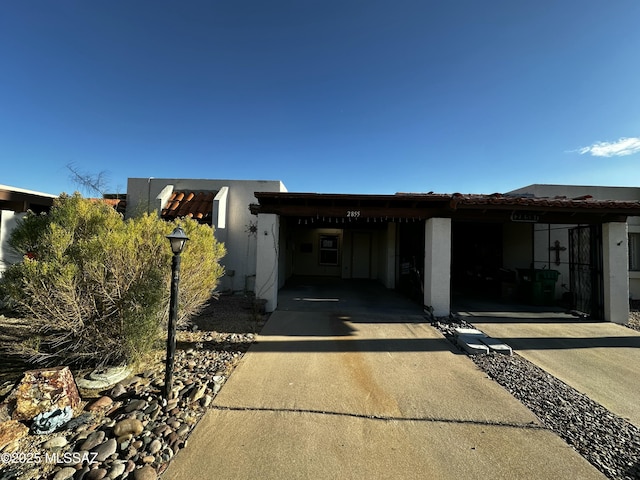 view of front of home featuring a carport