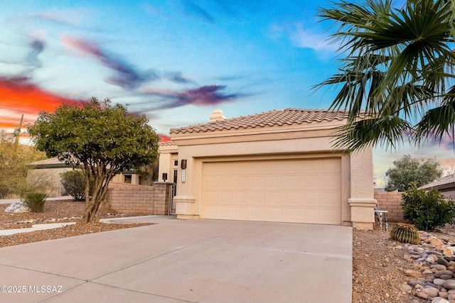 mediterranean / spanish-style home featuring a garage