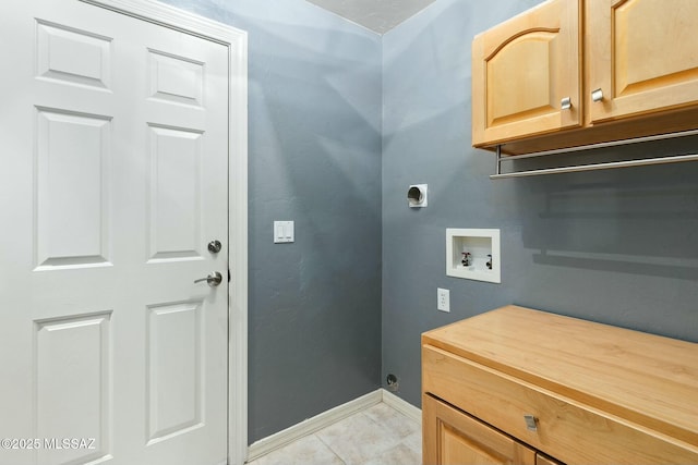 washroom featuring hookup for a washing machine, hookup for an electric dryer, cabinets, and light tile patterned floors