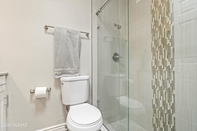 bathroom featuring an enclosed shower and toilet