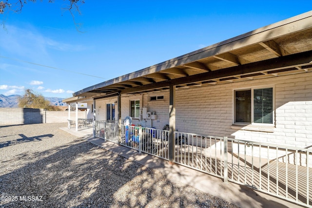 property entrance featuring a patio and a mountain view