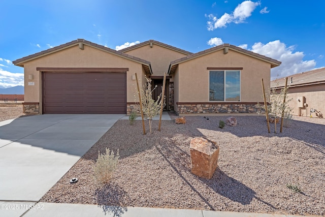 ranch-style house featuring a garage