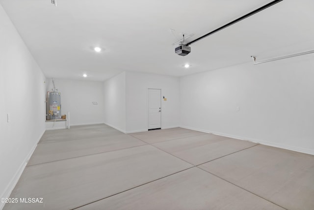 garage featuring a garage door opener and gas water heater