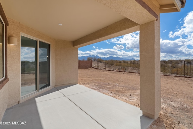 view of patio / terrace with a mountain view