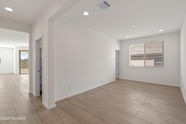 unfurnished room with light hardwood / wood-style flooring