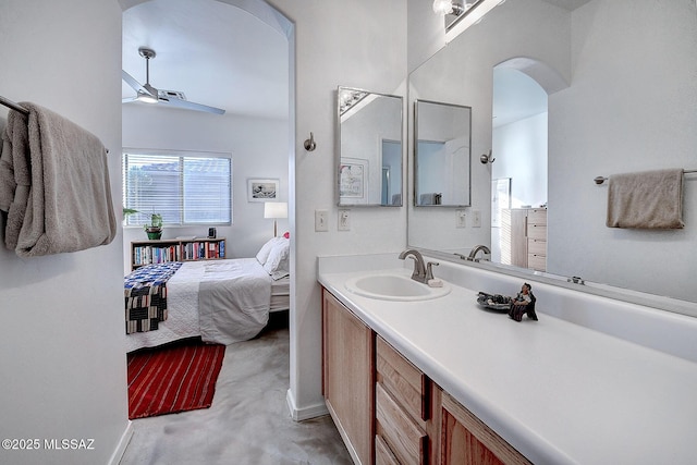 bathroom featuring ceiling fan and vanity