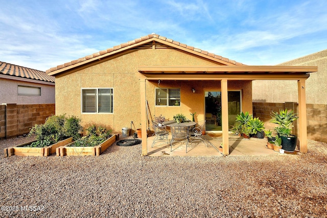 rear view of property with a patio area