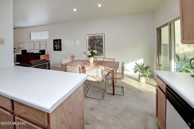 kitchen with a center island, dishwasher, and light brown cabinets