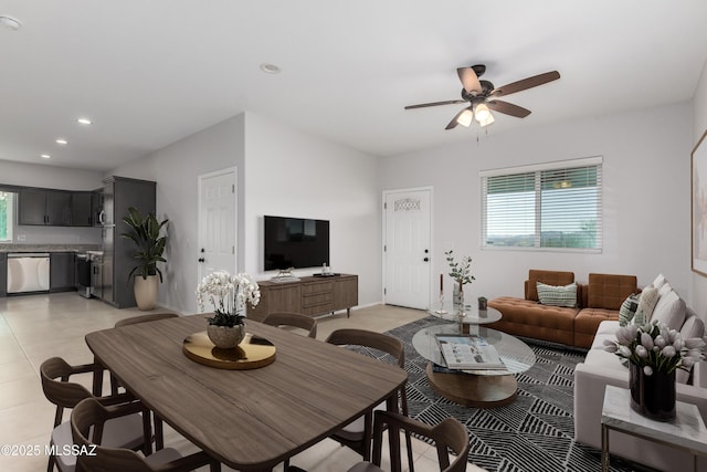 living room featuring a healthy amount of sunlight and ceiling fan