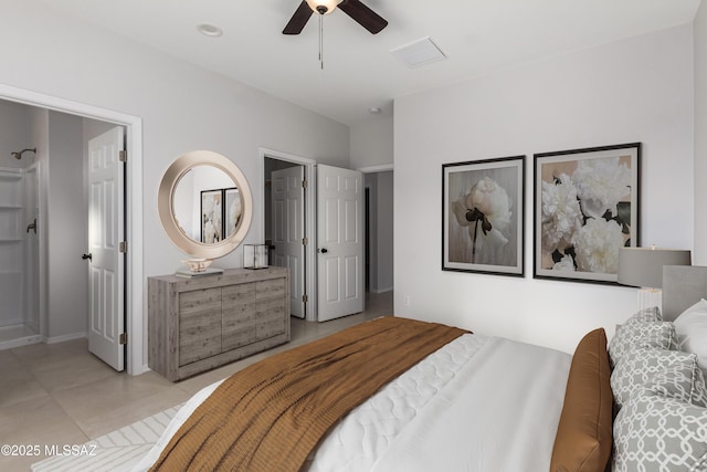 tiled bedroom featuring ceiling fan