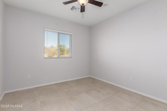 tiled empty room with ceiling fan