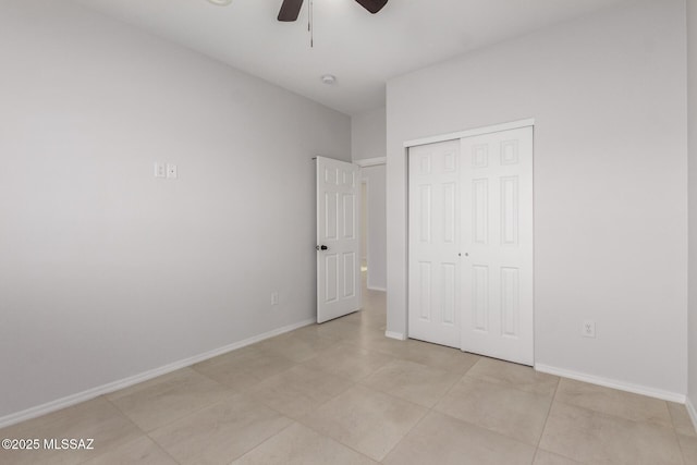 unfurnished bedroom with a closet and ceiling fan