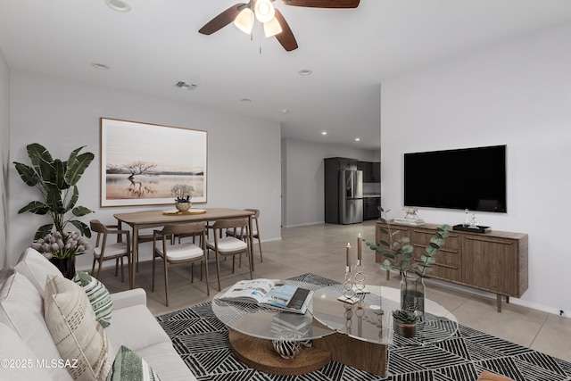 tiled living room featuring ceiling fan