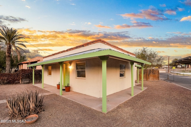 view of property exterior at dusk