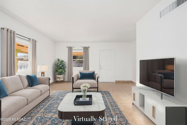 living room with light tile patterned floors and a healthy amount of sunlight