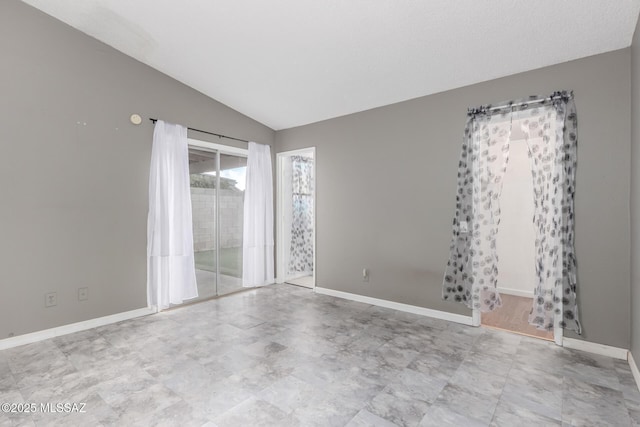 empty room with lofted ceiling