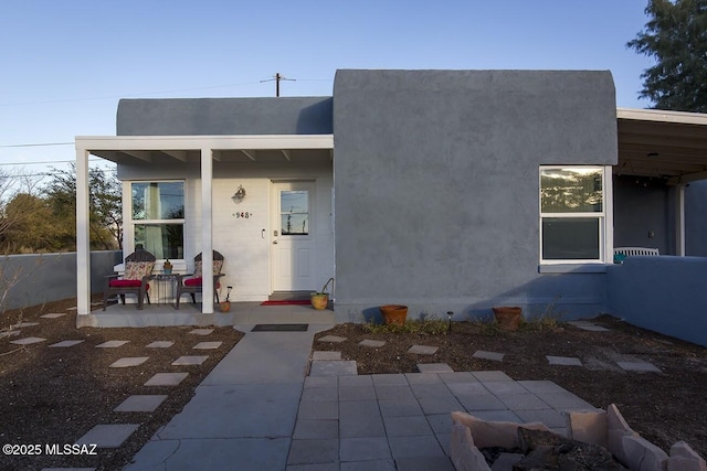 rear view of property featuring a patio area