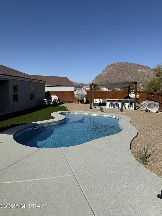 view of pool with a gazebo, a mountain view, and a patio