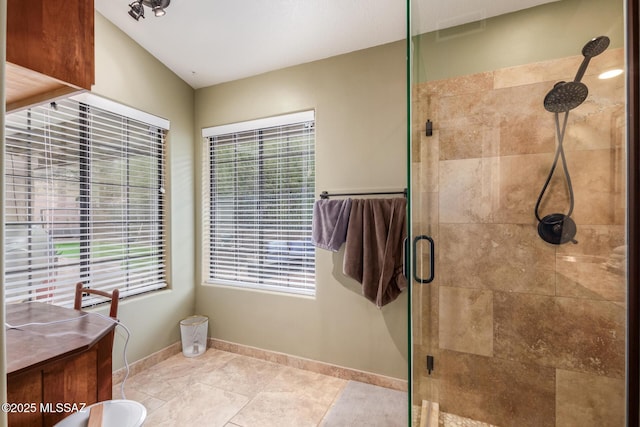 bathroom with walk in shower and vanity