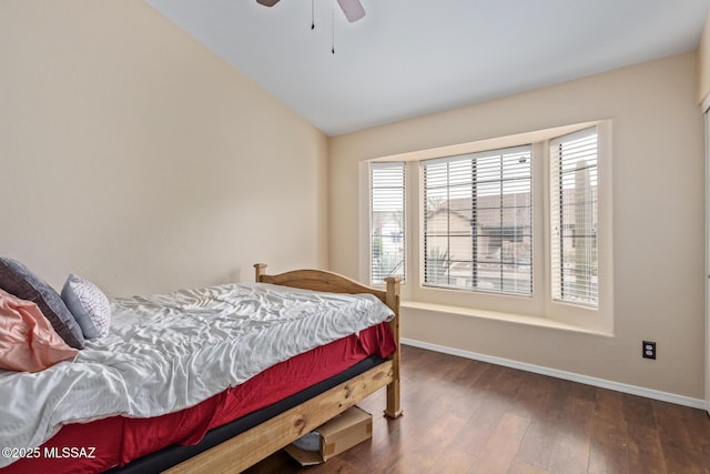 bedroom featuring lofted ceiling, dark hardwood / wood-style floors, and ceiling fan