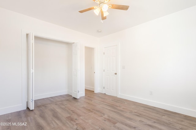 unfurnished bedroom with ceiling fan and light hardwood / wood-style floors