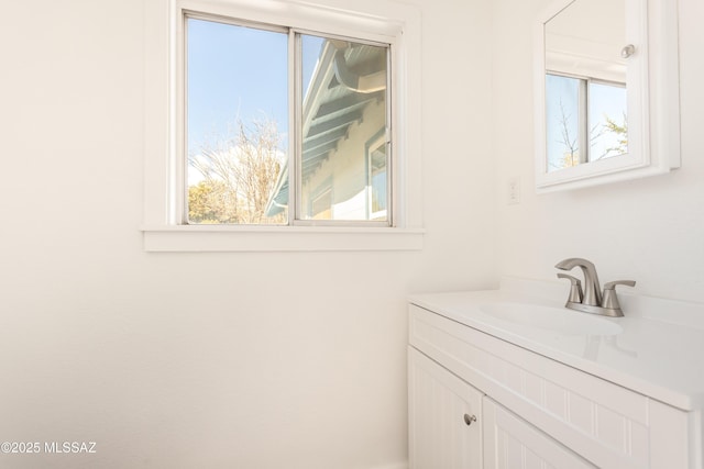 bathroom with vanity and a wealth of natural light