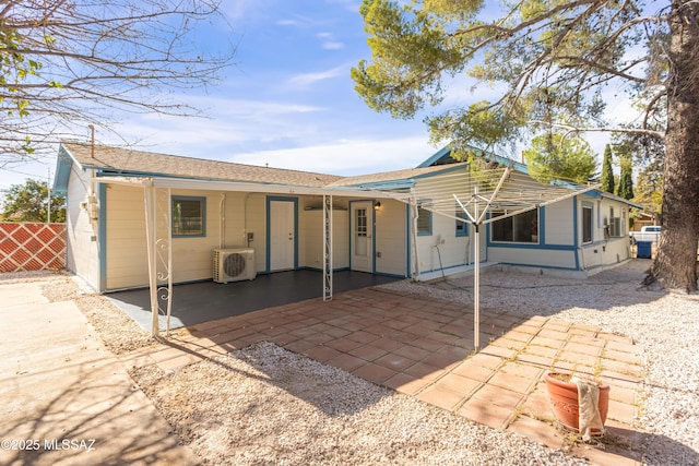 back of house with ac unit and a patio area