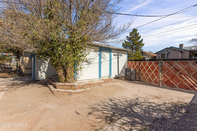 exterior space featuring a patio and an outdoor structure