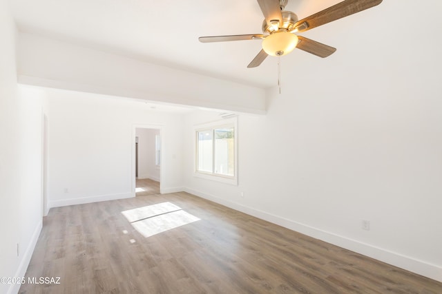 unfurnished room featuring hardwood / wood-style flooring and ceiling fan
