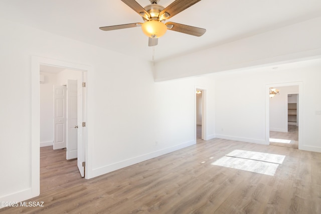 spare room featuring ceiling fan and light hardwood / wood-style flooring