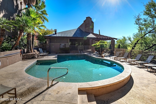 view of swimming pool featuring a patio