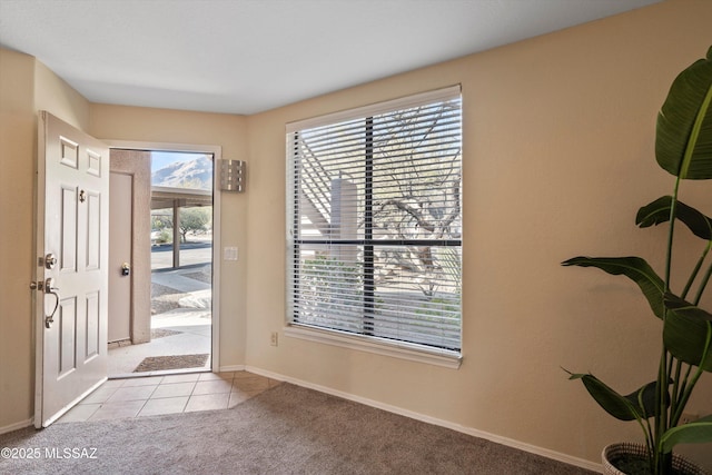 entrance foyer featuring light carpet