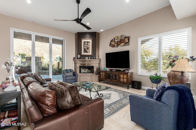 tiled living room featuring ceiling fan