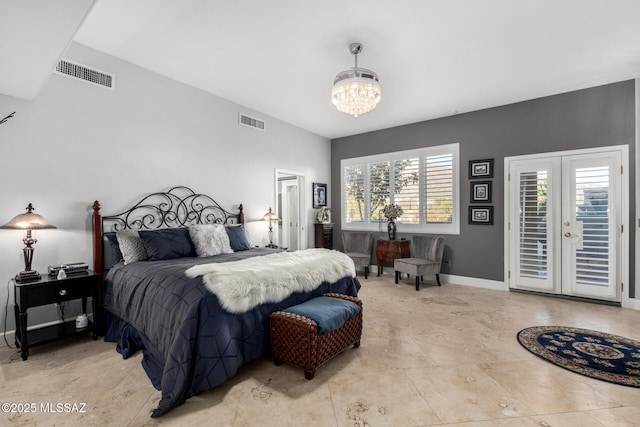 bedroom with access to exterior and a notable chandelier