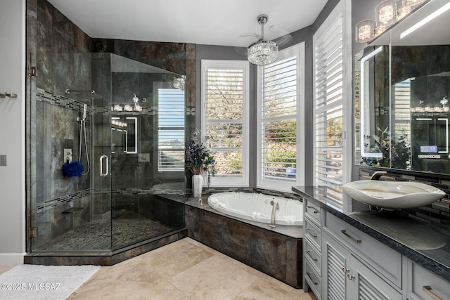 bathroom with plus walk in shower, vanity, and an inviting chandelier