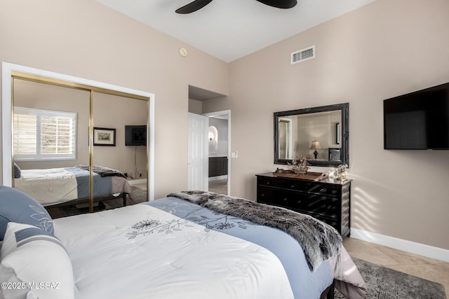 bedroom with tile patterned flooring, a closet, and ceiling fan