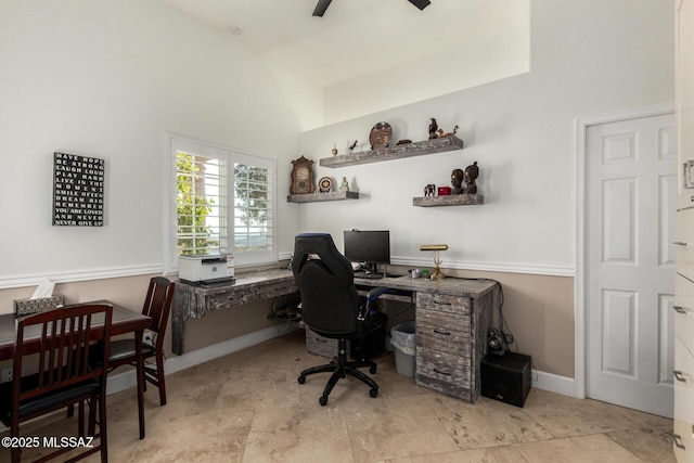 office space with high vaulted ceiling and ceiling fan