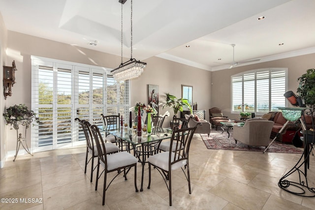 dining space with crown molding and light tile patterned floors