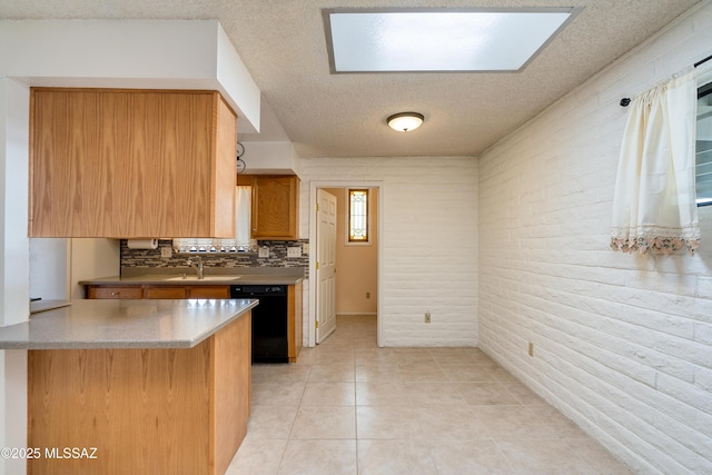 kitchen with light tile patterned flooring, black dishwasher, sink, decorative backsplash, and kitchen peninsula