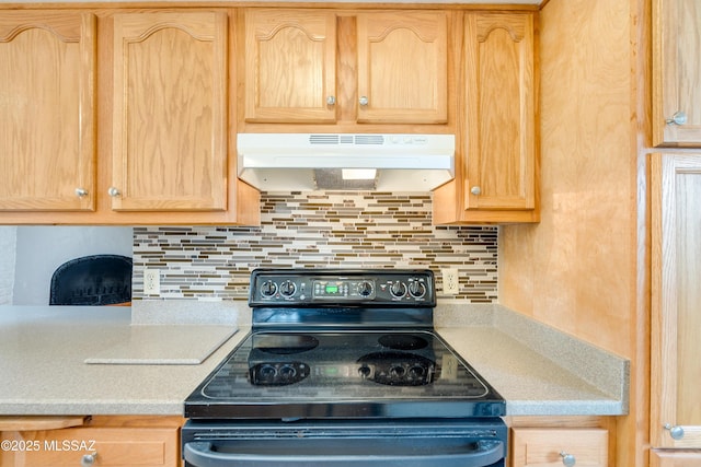 kitchen featuring light brown cabinets, backsplash, and black range with electric cooktop