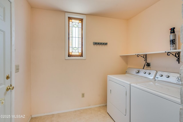 washroom featuring washer and dryer