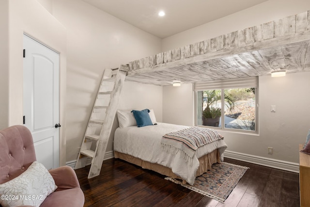 bedroom featuring dark hardwood / wood-style flooring