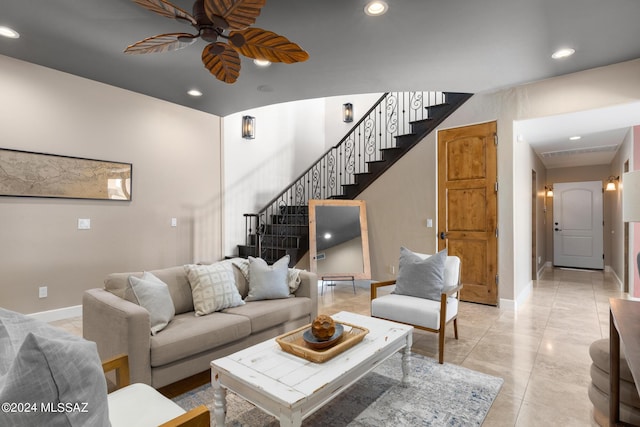 living room featuring light tile patterned flooring and ceiling fan