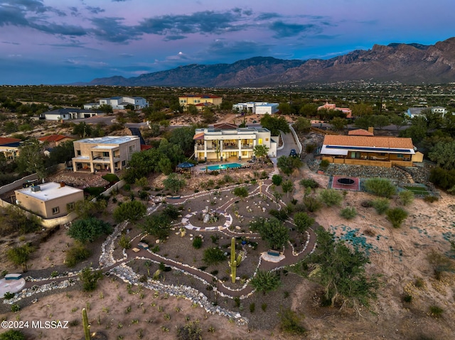 aerial view at dusk with a mountain view