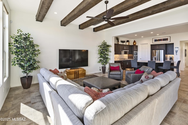 living room featuring beam ceiling and ceiling fan