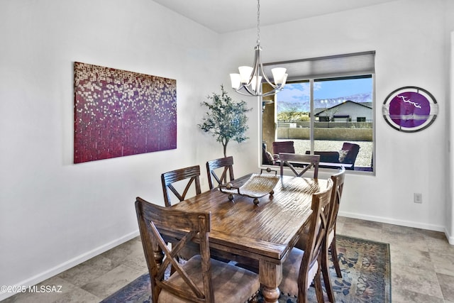 dining area featuring a notable chandelier