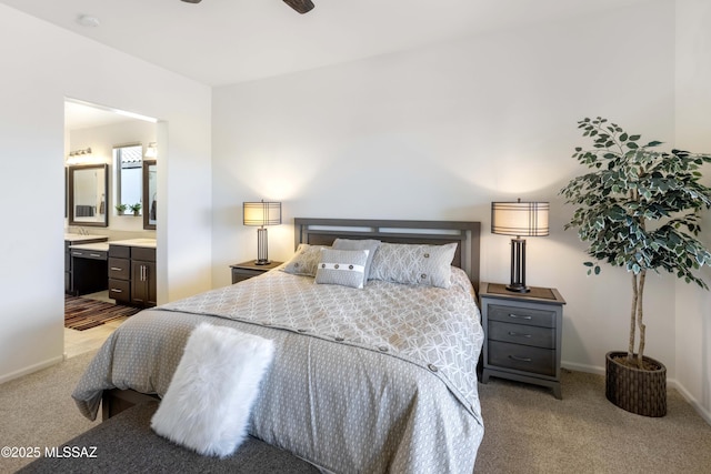 bedroom with light carpet and ensuite bath