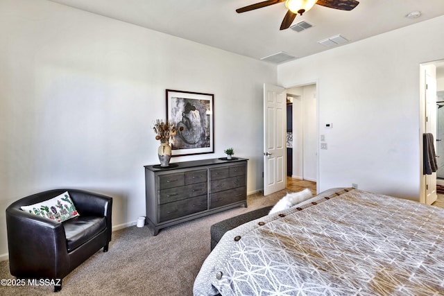 carpeted bedroom with connected bathroom and ceiling fan