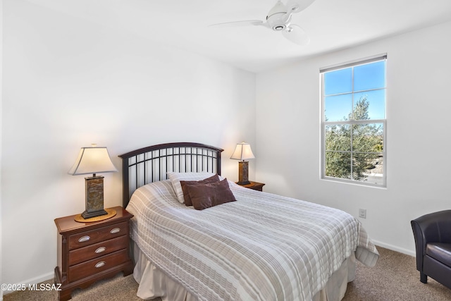 bedroom featuring ceiling fan and light colored carpet