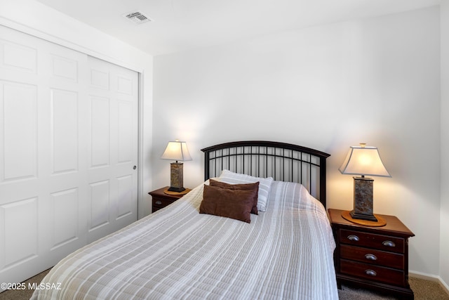 bedroom featuring carpet and a closet